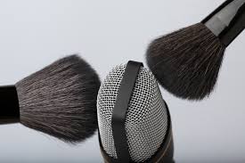 brushes close to microphone for asmr
