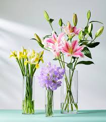 Place flowers in the water and use floral tape to create a crisscross grid around the mouth of the vessel. 20 Classic Flower Arrangements For Stunning Bouquets At Home Better Homes Gardens