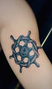 One modified version you can try is anchor and compass tattoo like this. 70 Ship Wheel Tattoo Designs For Men A Meaningful Voyage Ship Wheel Tattoo Trendy Tattoos Tattoo Designs