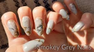 smokey grey gel nails with gold