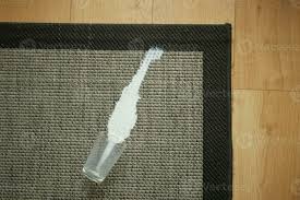milk spilled on gray carpet 25172784