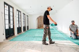 laying heated flooring under tile