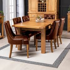 Extendable dining tables come into their own at family gatherings and larger dinner parties. Solid Oak Medium Dining Table 6 X Luxury Brown Scoop Back Dining Chairs The Furniture Market