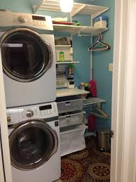 Small enough to install in a closet. Tiny Laundry Room Stacked Washer Dryer Elfa Organization Stacked Laundry Room Laundry Room Closet Laundry Room Storage Shelves