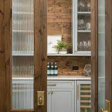 wood and rippled glass pantry doors