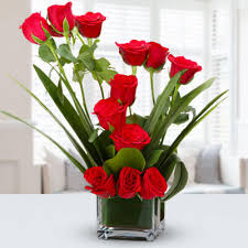 red roses in a glass vase flowers