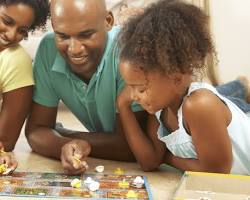 Image of Family playing board games