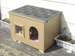 This easy cat house will keep your feline friends safe and warm when. Could Stack These For Multiple Cats I Don T Know About The Window In The Summer But It Would Be Good For Winter Cat House Diy Dog House Diy Outdoor Cat House