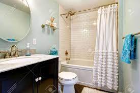 There's even room for a basket on the lower shelf. Aqua Bathroom With Dark Floor And Tile Wall Trim View Of Bathroom Stock Photo Picture And Royalty Free Image Image 28997014