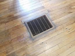 brown wood floor air vent or register