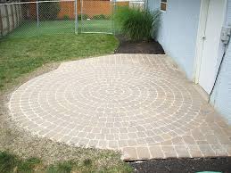 a round paver patio with a washington