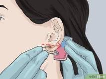 Can I use a safety pin to pierce my ear?