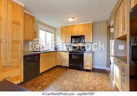 Considering maple wood kitchen cabinets? Maple Cabinets In Modern Kitchen With Brown Walls Canstock