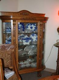 fancy carved clawfoot china cabinet