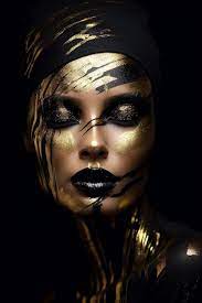gold painted face and black makeup