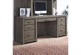 A credenza desk (often simply, credenza) is a modern desk form usually placed next to a wall as a secondary work surface to that of another desk, such as a pedestal desk, in a typical executive office. Aspenhome Modern Loft Contemporary 72 Credenza Desk With Locking Files And Ac Power Outlets Darvin Furniture Double Pedestal Desks