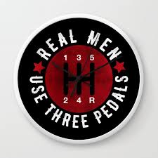 Real Men Use Three Pedals Wall Clock By