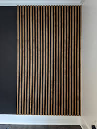 Stained Wood Slat Wall Installed On