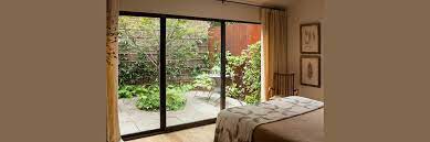 A Bedroom With A Sliding Glass Door
