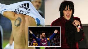 A tattoo of jesus' face with a crown of positions of royalty sits upon this football legends right arm. Mother Of All Insults English Comedian Mocks Messi Over Bizarre Tattoo Likeness To His Mom Video Rt Sport News