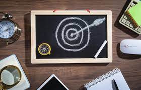 Target And Arrow On Small Chalkboard