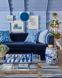 blue velvet couch with art deco coffee