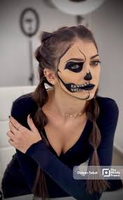 makeup artist showing half face the