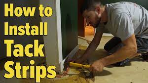 install tack strips on a concrete floor