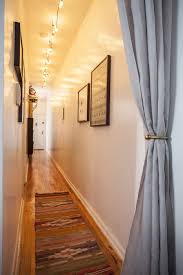 Search for pictures of hallway photos and hallway renovations to find inspiration for your hallway emily bartlett photography design ideas for a contemporary hallway in melbourne with white walls photo of a contemporary hallway in adelaide with white walls, dark hardwood floors and brown floor. A Different Take On Hallway Lighting Hallway Lighting Small Hallways Narrow Hallway