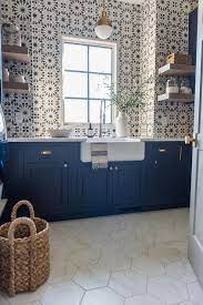 navy blue laundry cabinets with white