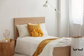 single wooden bed stock photo