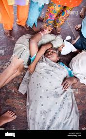 An Indian family sleeping Stock Photo - Alamy