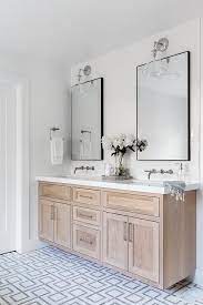A Brushed Oak Dual Bath Vanity Sits On