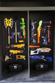 I put an over the door shoe rack on his door to put the nerf guns in! Nerf Storage Ideas A Girl And A Glue Gun