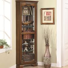 Complement your bedroom or guest room with this modest curio cabinet. Curio Cabinets 5 Shelf Corner Curio With 1 Door Acanthus Leaf Top Sadler S Home Furnishings Curio Cabinets
