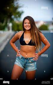 Portrait of smiling Pacific Islander girl wearing bikini in street Stock  Photo - Alamy