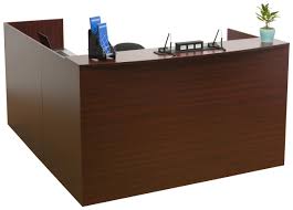The dimensions are 67 w x 67 d x 33 h. L Shaped Reception Desk 4 Mahogany Drawers