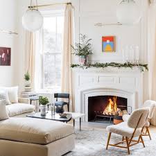 The appeal of gathering around a softly flickering flame taps into our primitive needs for warmth and security. How To Create A Cozy Living Room This Winter Love Happens Magazine