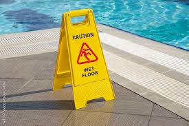 caution wet floor warning sign near