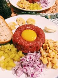 creamy steak tartare with egg and