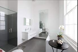 White Walls Grey Floors In The Bathroom