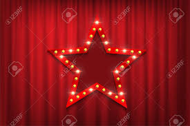 Red Star Sign With Light Bulbs Against Theatre Red Curtains
