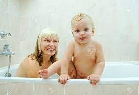 Mother And Her Son In The Bathroom Stock Photo, Picture and Royalty Free  Image. Image 8790864.