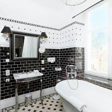 Using tiles in a mix of colors, shapes, and textures adds dimension to the small space. 19 Inspirational Black And White Bathrooms