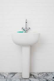 install a pedestal sink hide the pipes