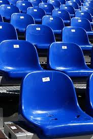 blue seats on stadium seating aisle