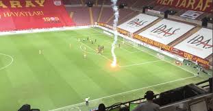 Galatasaray fans throw flares onto the pitch during. Galatasaray Flare Still Manages To Get On Field Despite No Fans