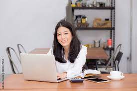 Beautiful Asian Young Woman Working Online On Laptop Sitting At Coffee  gambar png