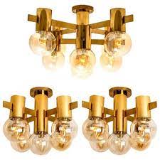 brass and glass light fixtures in the