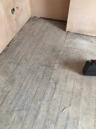 plaster dust from wooden floorboards